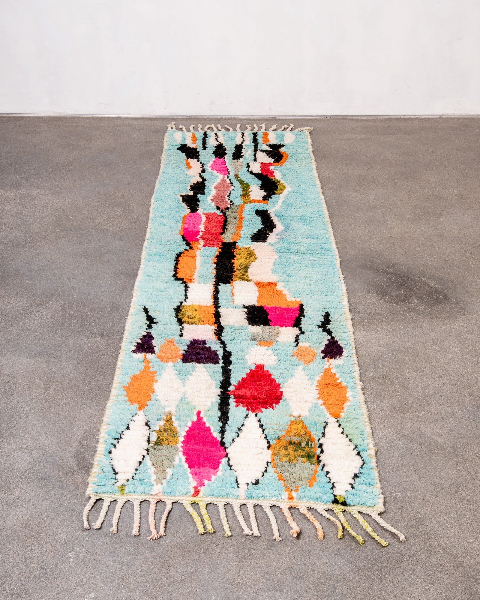 Vintage, handcrafted Berber rug from Morocco. Boucherouite carpet with beautiful colours and patterns and heavy cotton texture.